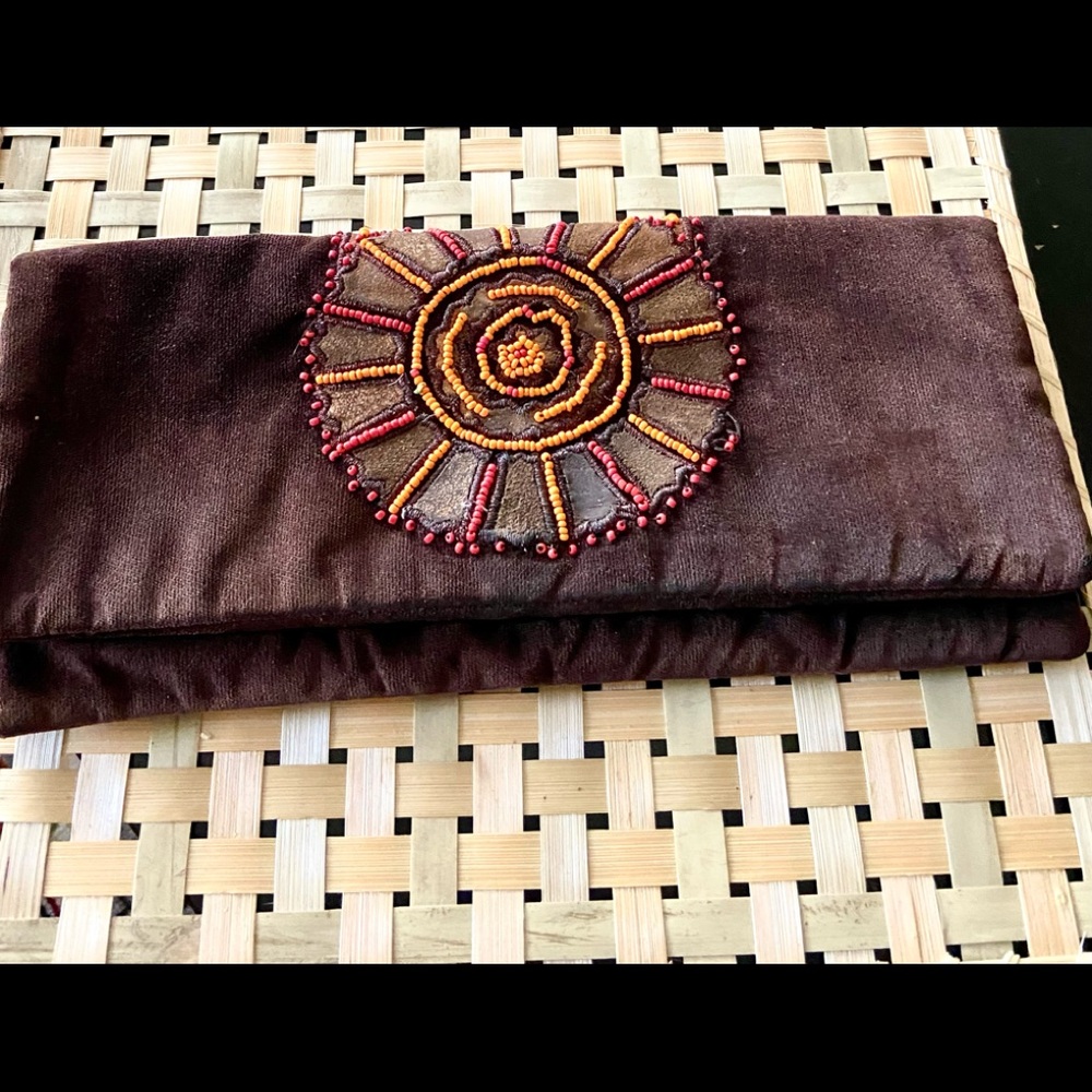 Tory Burch clutch with bead design